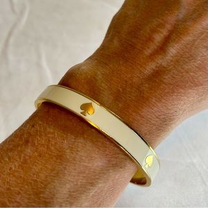 KATE SPADE New York logo, stacking bracelet in cream. 1/4” wide.
